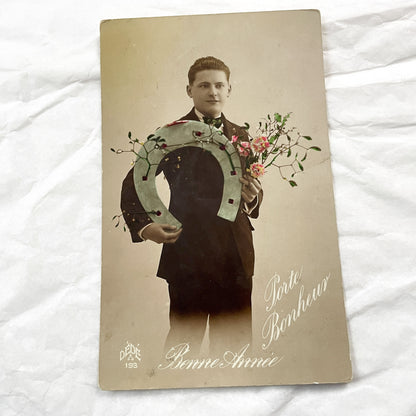 1920s - Vintage French New Year Postcard - Young Man Holding Lucky Horseshoe - Hand Colored Sepia Photo - Collectible Good Luck Ephemera