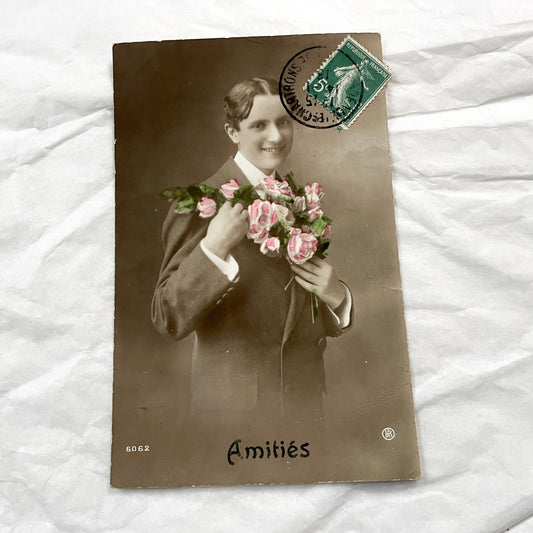 1910s - Vintage French Hand-Colored Postcard - Smiling Man with Pink Roses - Friendship Sentiment - Original Sepia Photo
