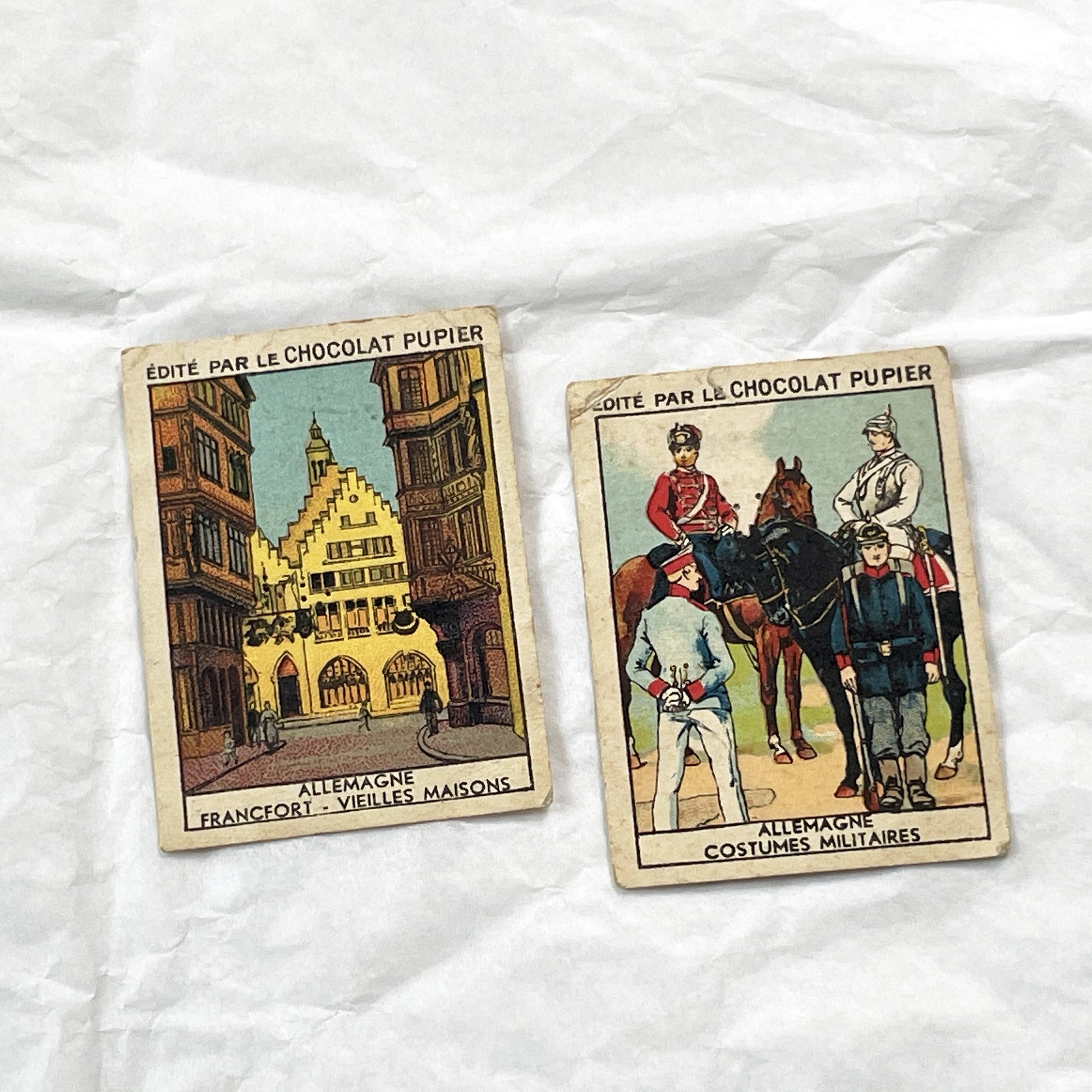 1910s - 10 Pupier Chocolate Trade Cards - Historical Figures and Cultural Heritage - Germany, Italy, Zeppelin, WWI, Art, Military, Cities