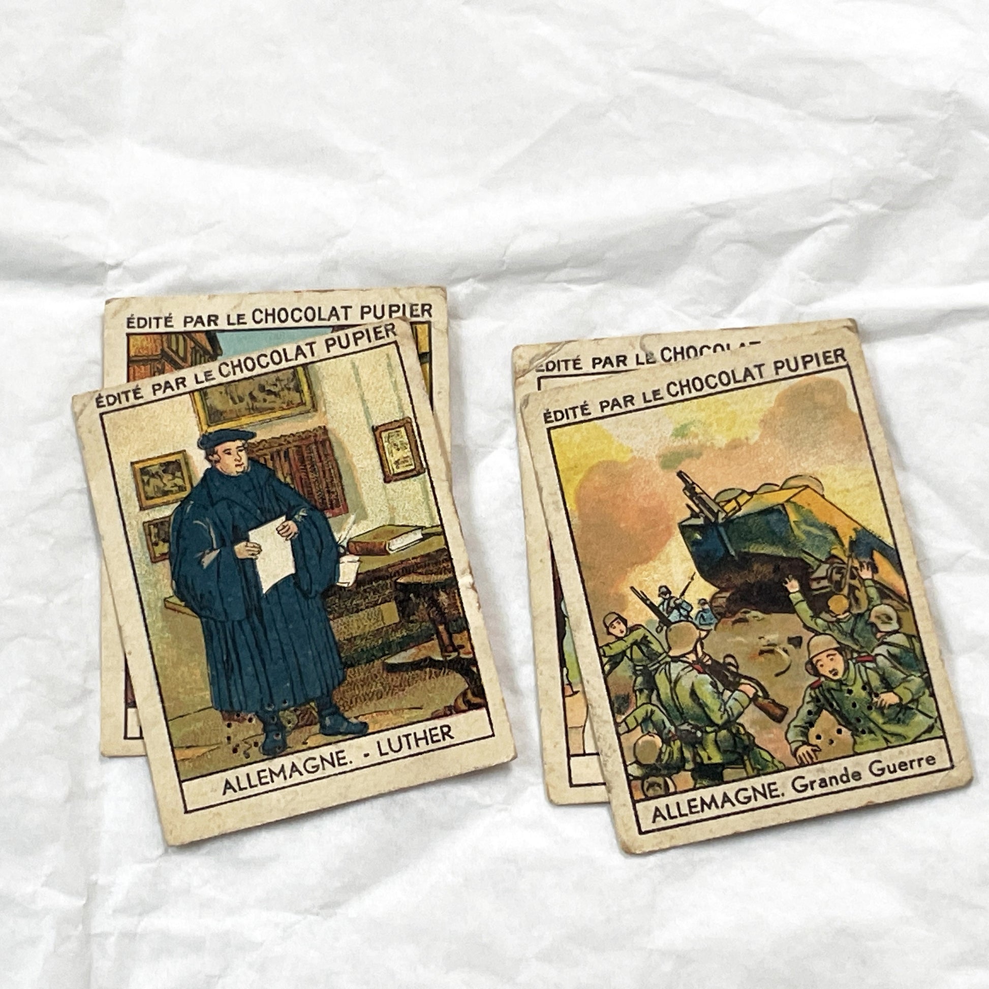 1910s - 10 Pupier Chocolate Trade Cards - Historical Figures and Cultural Heritage - Germany, Italy, Zeppelin, WWI, Art, Military, Cities