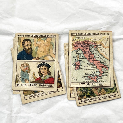 1910s - 10 Pupier Chocolate Trade Cards - Historical Figures and Cultural Heritage - Germany, Italy, Zeppelin, WWI, Art, Military, Cities