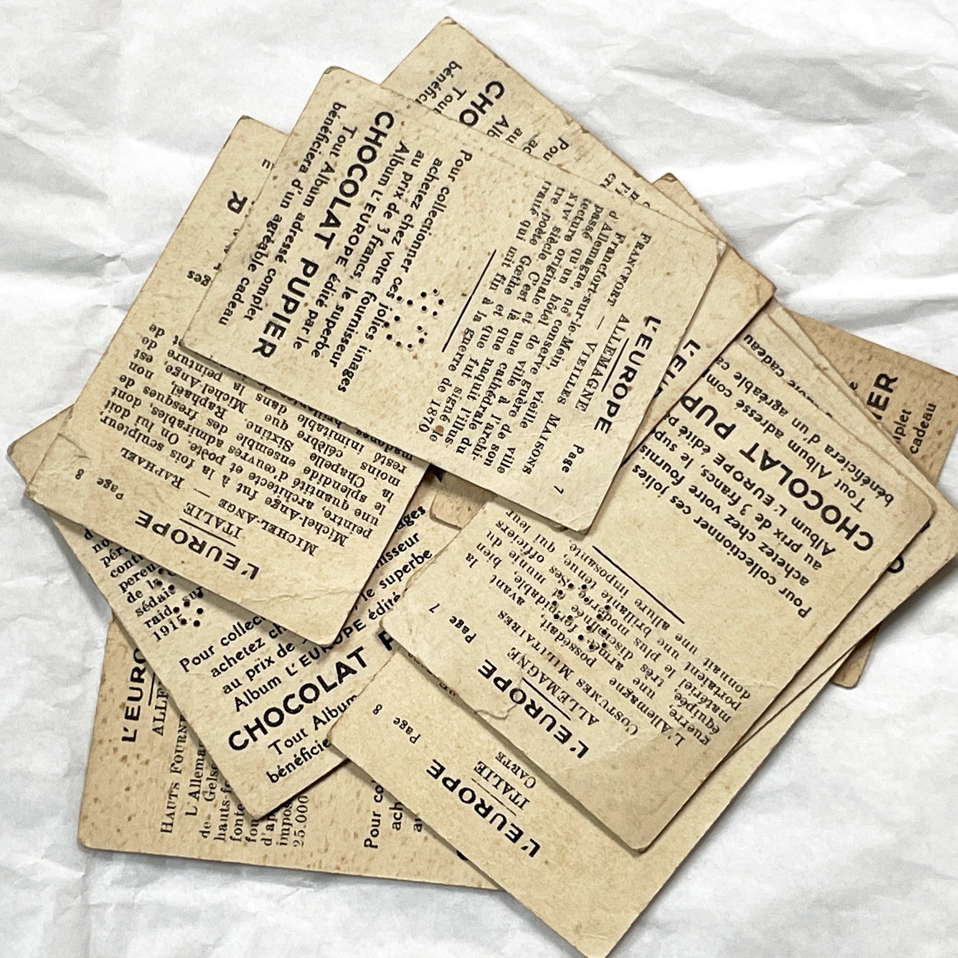 1910s - 10 Pupier Chocolate Trade Cards - Historical Figures and Cultural Heritage - Germany, Italy, Zeppelin, WWI, Art, Military, Cities