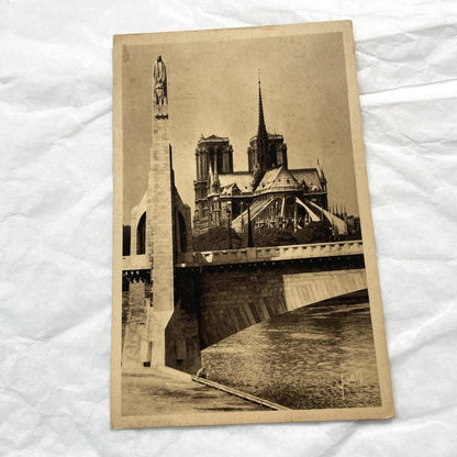 1930s - Vintage Notre Dame Cathedral Postcard - Paris France Architecture - Seine River Bridge View - Sepia Tone Print - Parisian Landmark