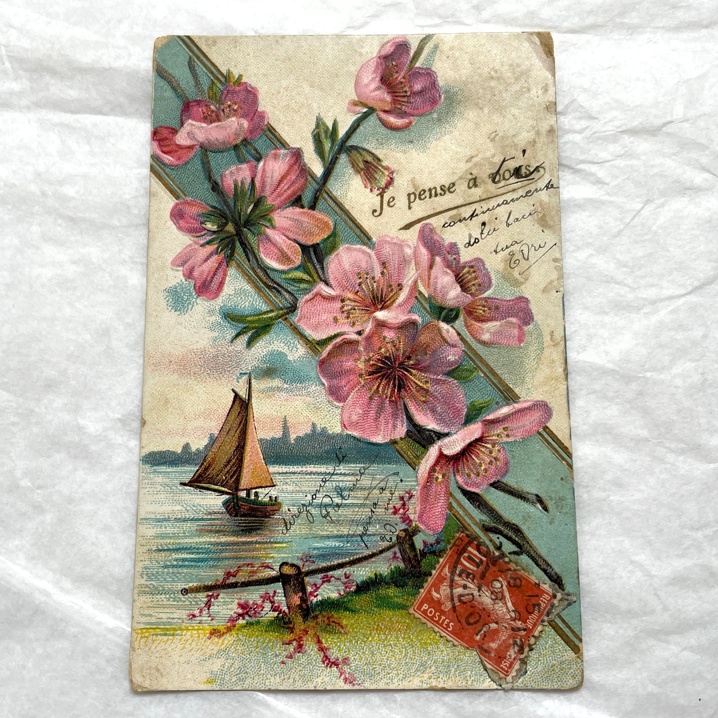 1900s French postcard with pink cherry blossoms, a sailboat, and a vintage French stamp