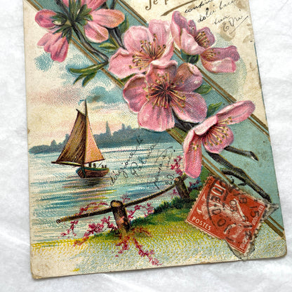 1900s French postcard with pink cherry blossoms, a sailboat, and a vintage French stamp
