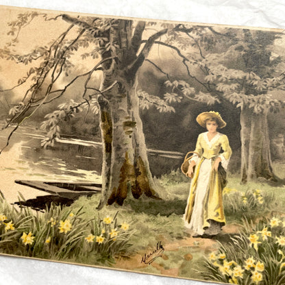 1900s French postcard depicting a woman in a yellow dress walking through a field of daffodils.