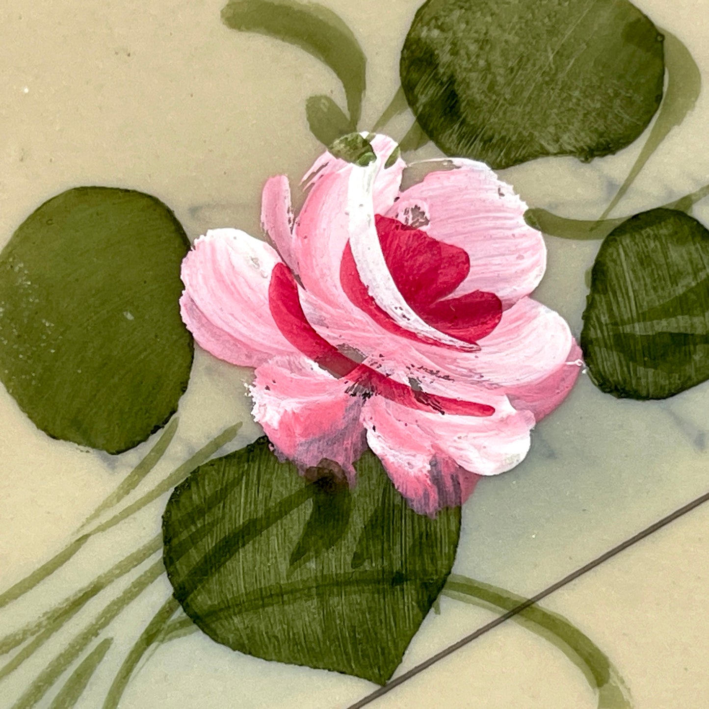1910s French greeting card with hand-painted pink rose, green leaves, and rustic landscape scene.