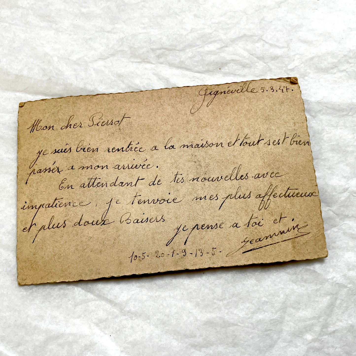 1940s French postcard with a sepia photo of a couple, framed by a blue ribbon heart and romantic French text.