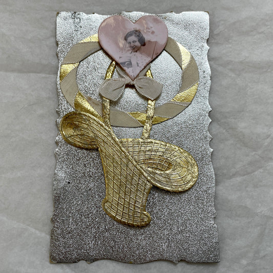1930s Vintage Keepsake Card with heart-shaped photo, gold weave, and silver embossed background. Elegant decorative piece.