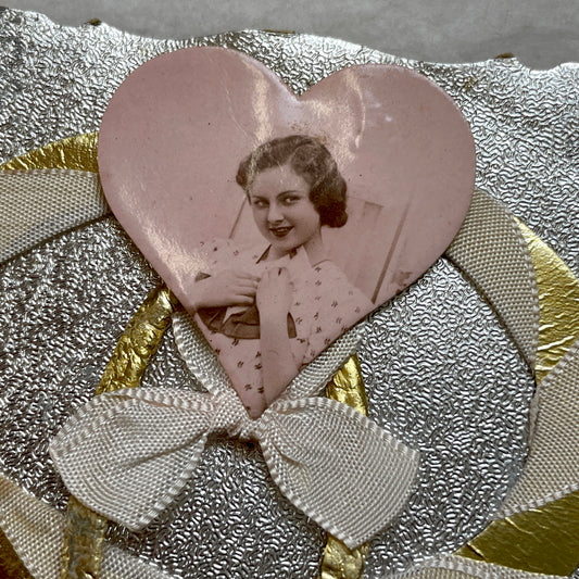 1930s Vintage Keepsake Card with heart-shaped photo, gold weave, and silver embossed background. Elegant decorative piece.