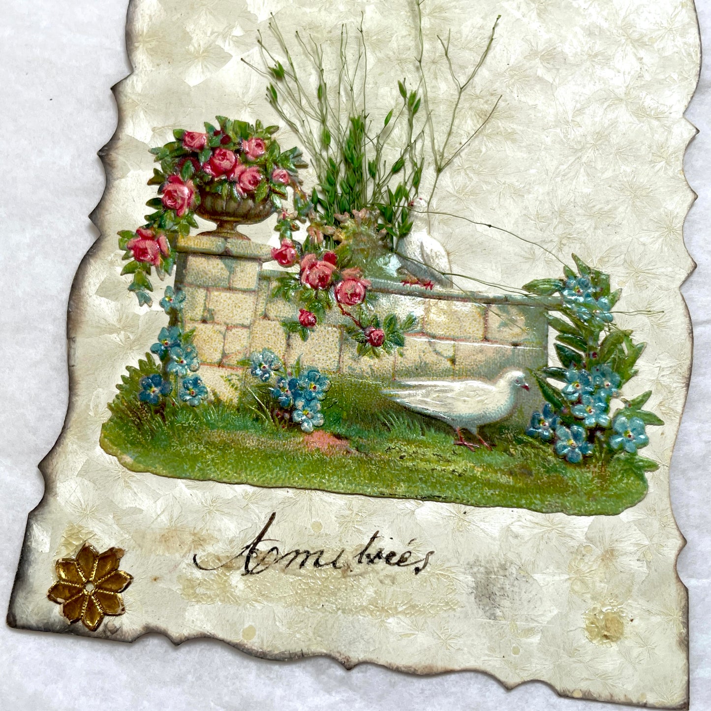 1900s Antique French greeting card with embossed doves, pink roses, blue forget-me-nots, and original postal stamp.