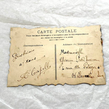 1900s Antique French greeting card with embossed doves, pink roses, blue forget-me-nots, and original postal stamp.