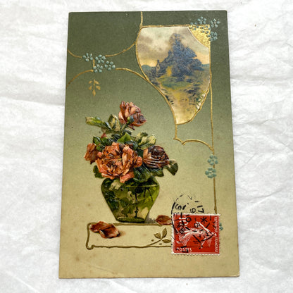 1910s French postcard with embossed roses in a vase, gilded decorative elements, a landscape vignette, and a red French stamp