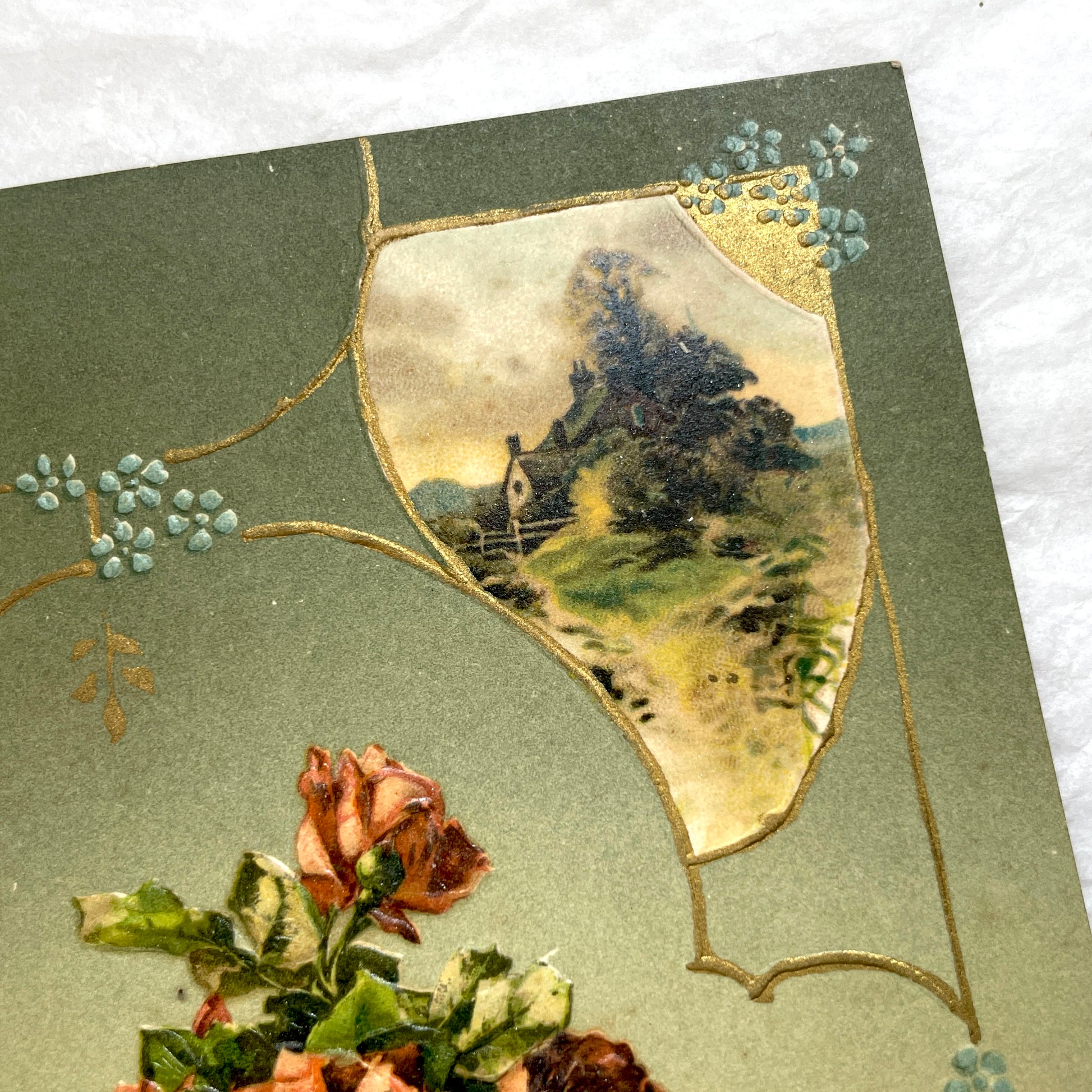 1910s French postcard with embossed roses in a vase, gilded decorative elements, a landscape vignette, and a red French stamp