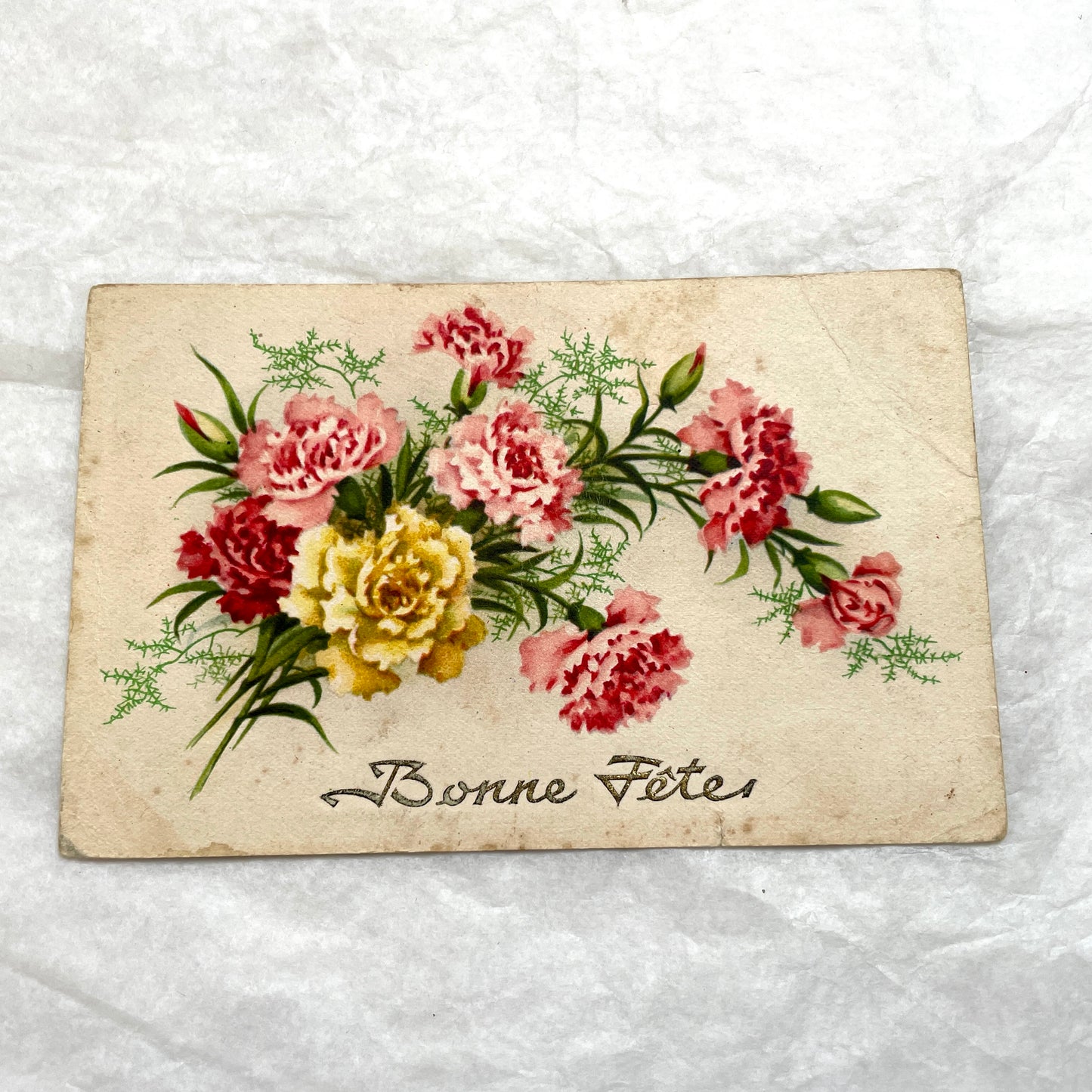 1900s French postcard lot showcasing four antique floral designs, including roses, carnations, and elegant French script.