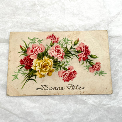 1900s French postcard lot showcasing four antique floral designs, including roses, carnations, and elegant French script.