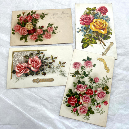 Lot of four vintage postcards from the 1940s featuring vibrant rose floral designs, some with French text and gold details.