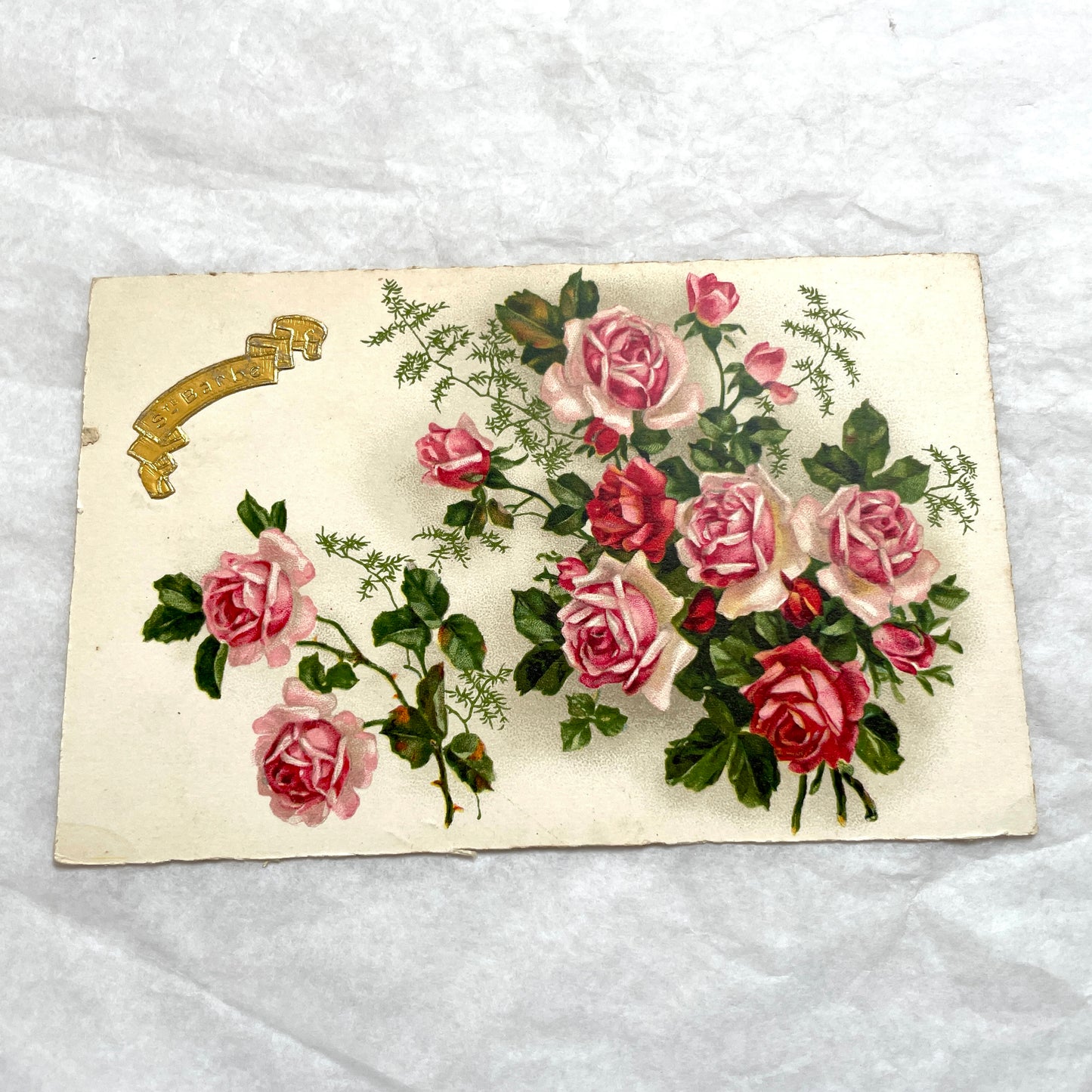 Lot of four vintage postcards from the 1940s featuring vibrant rose floral designs, some with French text and gold details.