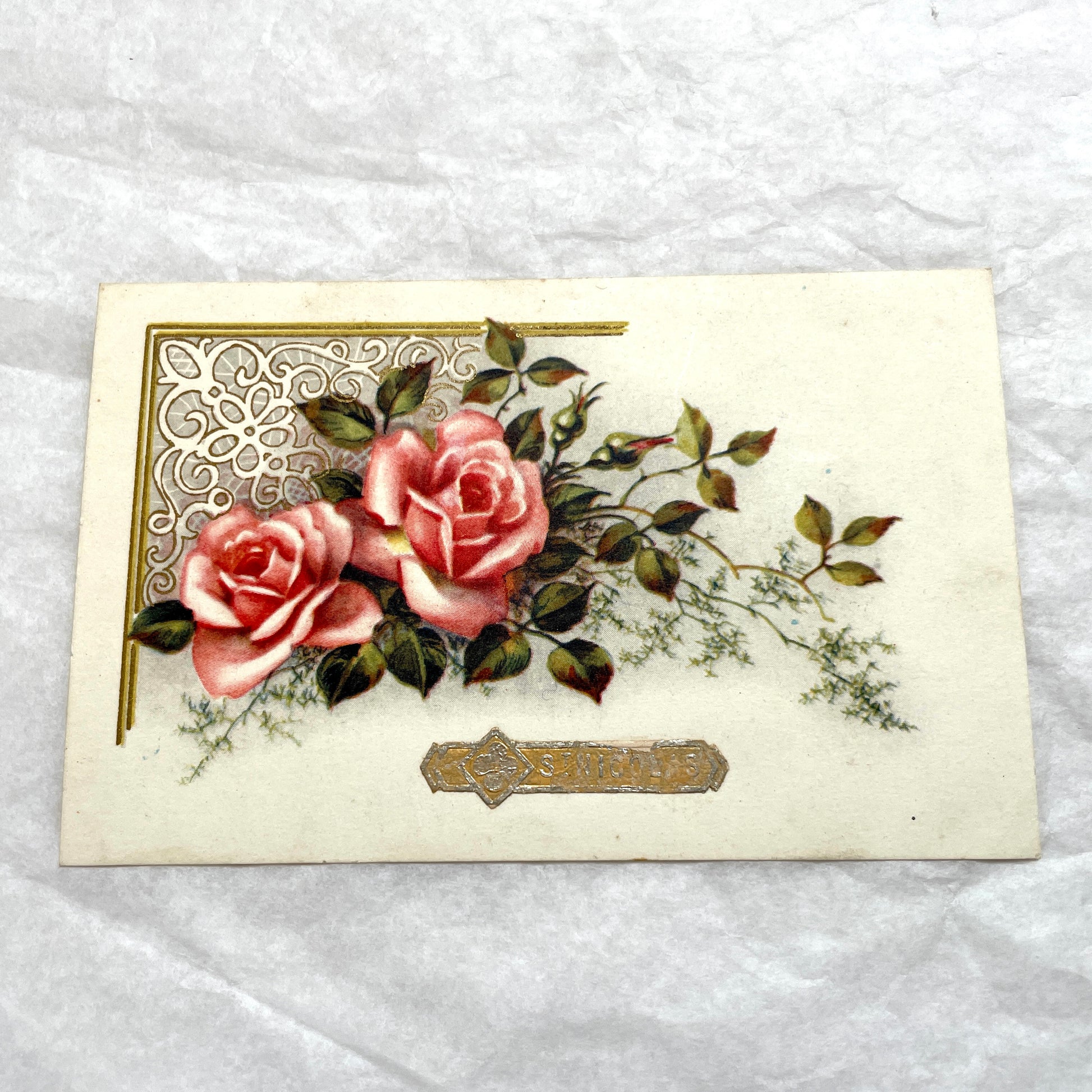 Lot of four vintage postcards from the 1940s featuring vibrant rose floral designs, some with French text and gold details.