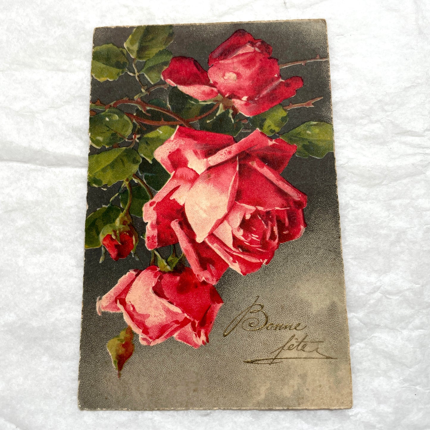 1930s lot of two antique French postcards with vibrant red and soft peach floral rose designs.