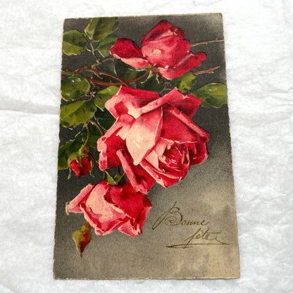 1930s lot of two antique French postcards with vibrant red and soft peach floral rose designs.