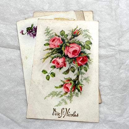 1910s French postcard lot with four antique floral rose greetings and celebratory French text, vintage ephemera.