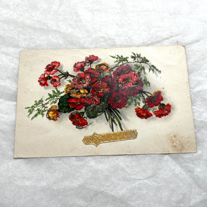 1900s French postcards lot with glitter floral designs and French text, vintage paper ephemera.