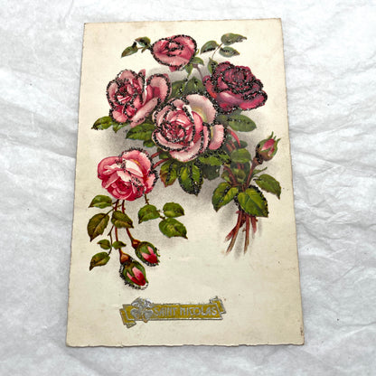 1910s French glitter postcard lot with purple pansies, pink roses, and red rose bouquets.