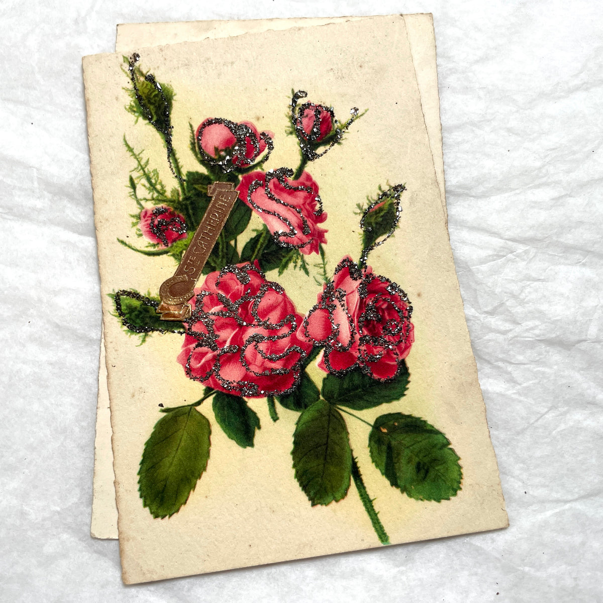 1910s French glitter postcard lot with purple pansies, pink roses, and red rose bouquets.