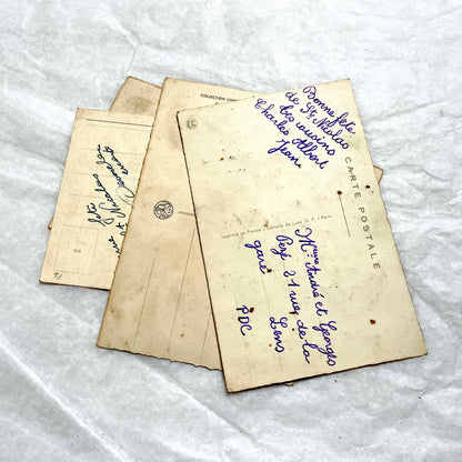 1910s French glitter postcard lot with purple pansies, pink roses, and red rose bouquets.