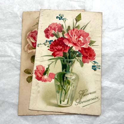 1900s French floral postcard lot featuring vintage illustrations of red roses and pink carnations in a classic style.