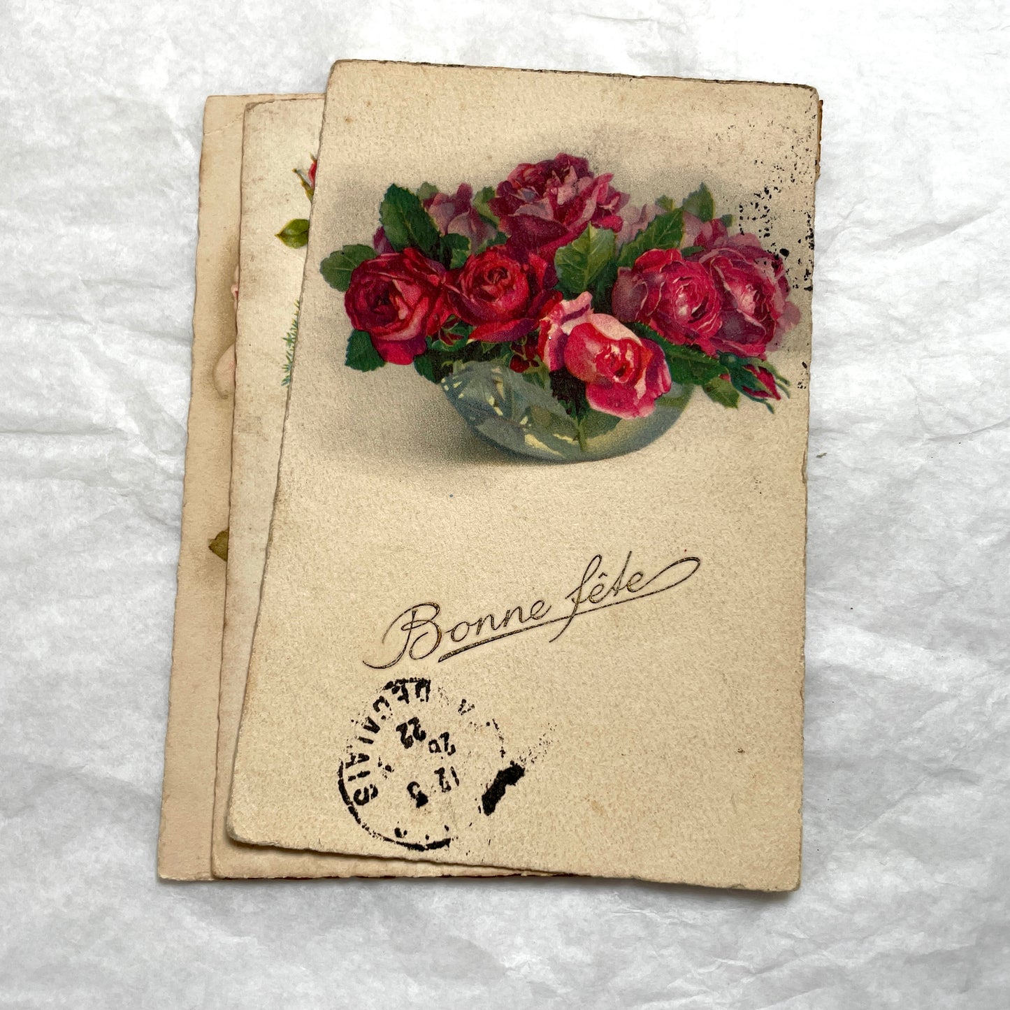 1900s French floral postcard lot featuring vintage illustrations of red roses and pink carnations in a classic style.