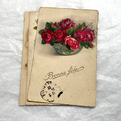 1900s French floral postcard lot featuring vintage illustrations of red roses and pink carnations in a classic style.