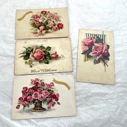 Four 1900s French vintage postcards with beautiful pink and red rose floral designs and 'St Catherine' banners.