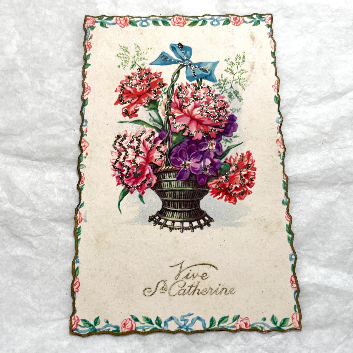 1950s French decorative card lot with floral baskets, glitter accents, and 'Vive Ste Catherine' inscription.