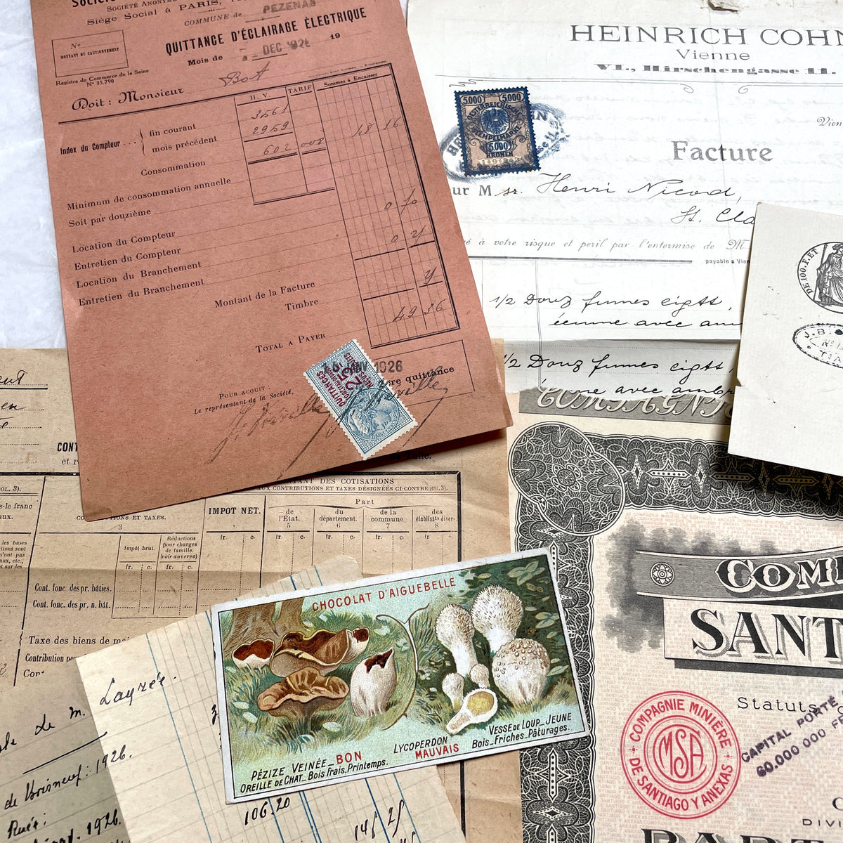 1920s French Ephemera Lot with vintage paper documents, old letters, invoices, postcards, photos, and stamps.