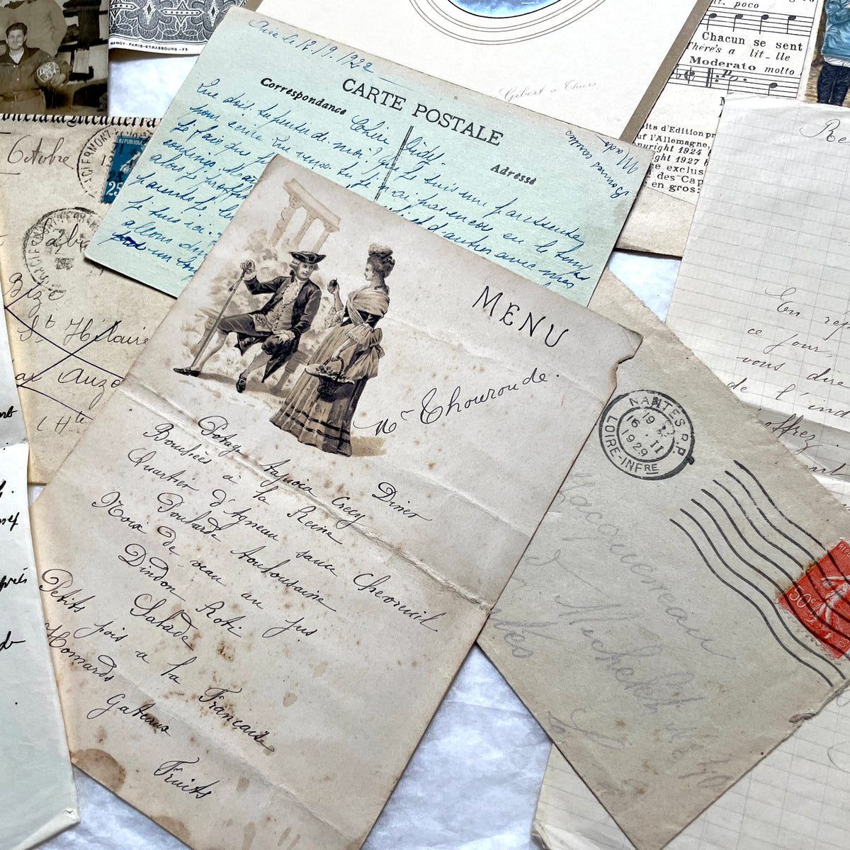 1920s French Ephemera Lot with vintage paper documents, old letters, invoices, postcards, photos, and stamps.
