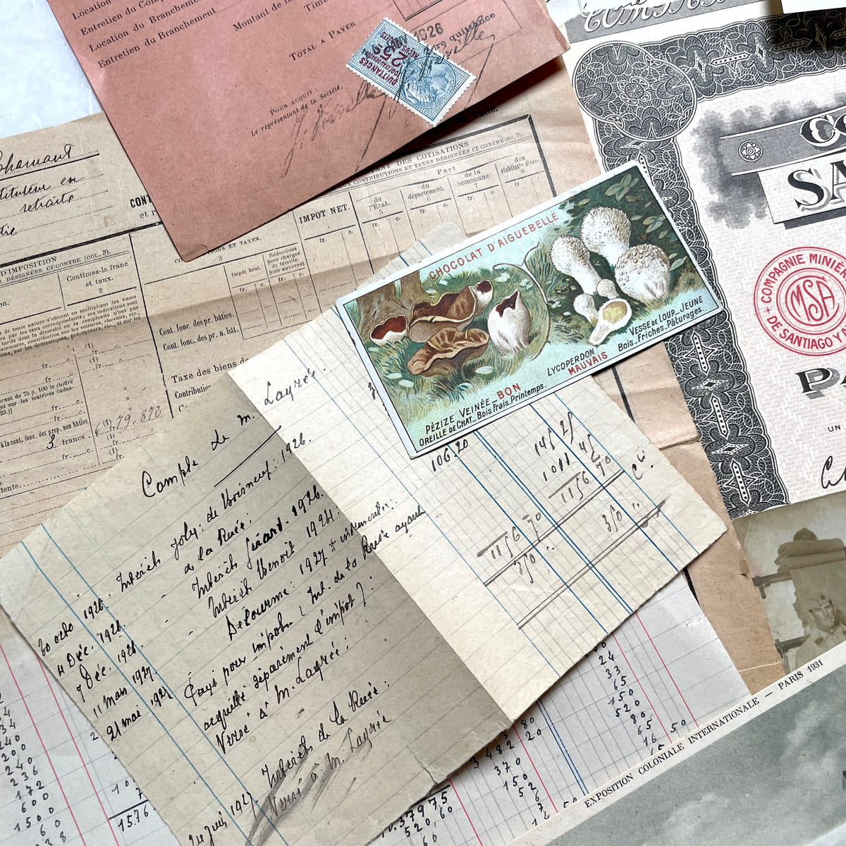 1920s French Ephemera Lot with vintage paper documents, old letters, invoices, postcards, photos, and stamps.