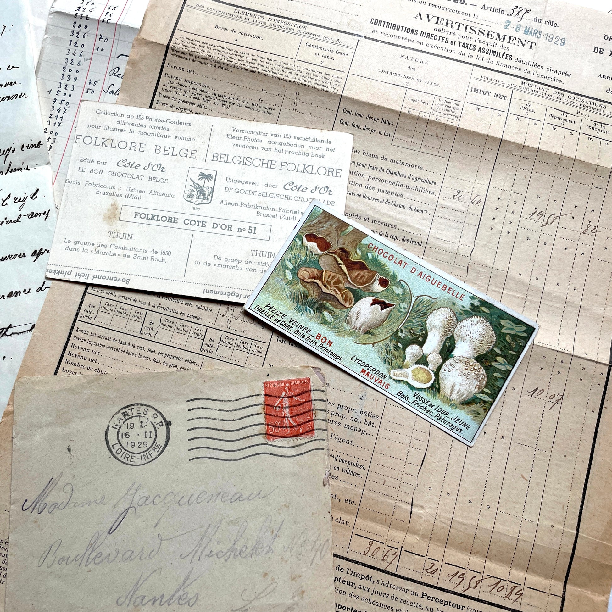 1920s French Ephemera Lot with vintage paper documents, old letters, invoices, postcards, photos, and stamps.