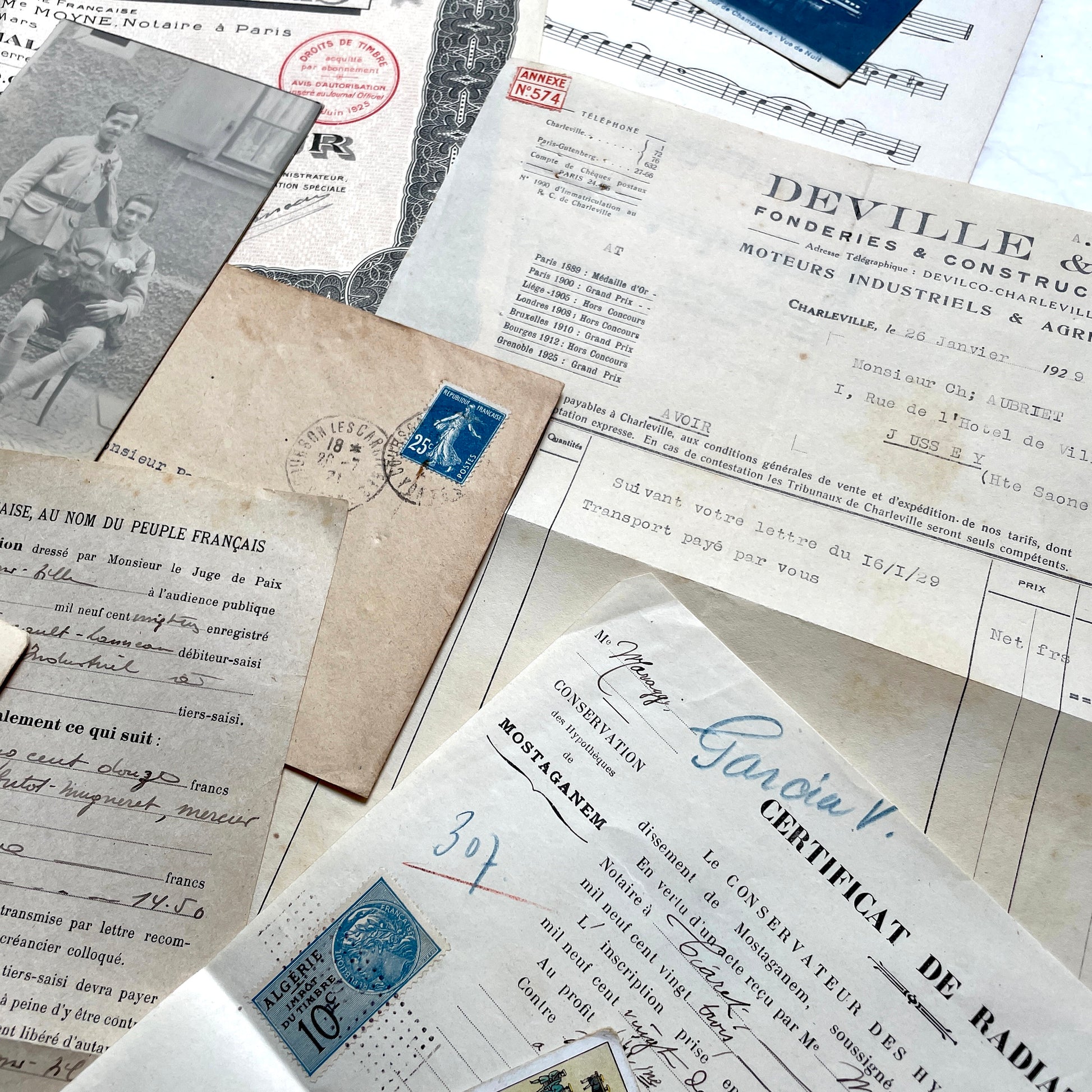 1920s French documents lot with vintage letters, receipts, menu, postcard, and stock certificate, all paper ephemera.
