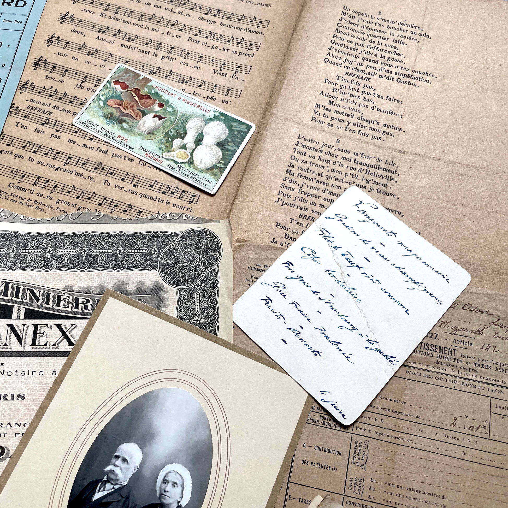 1920s French Documents Lot with a share certificate, handwritten letters, sheet music, and an old photograph.