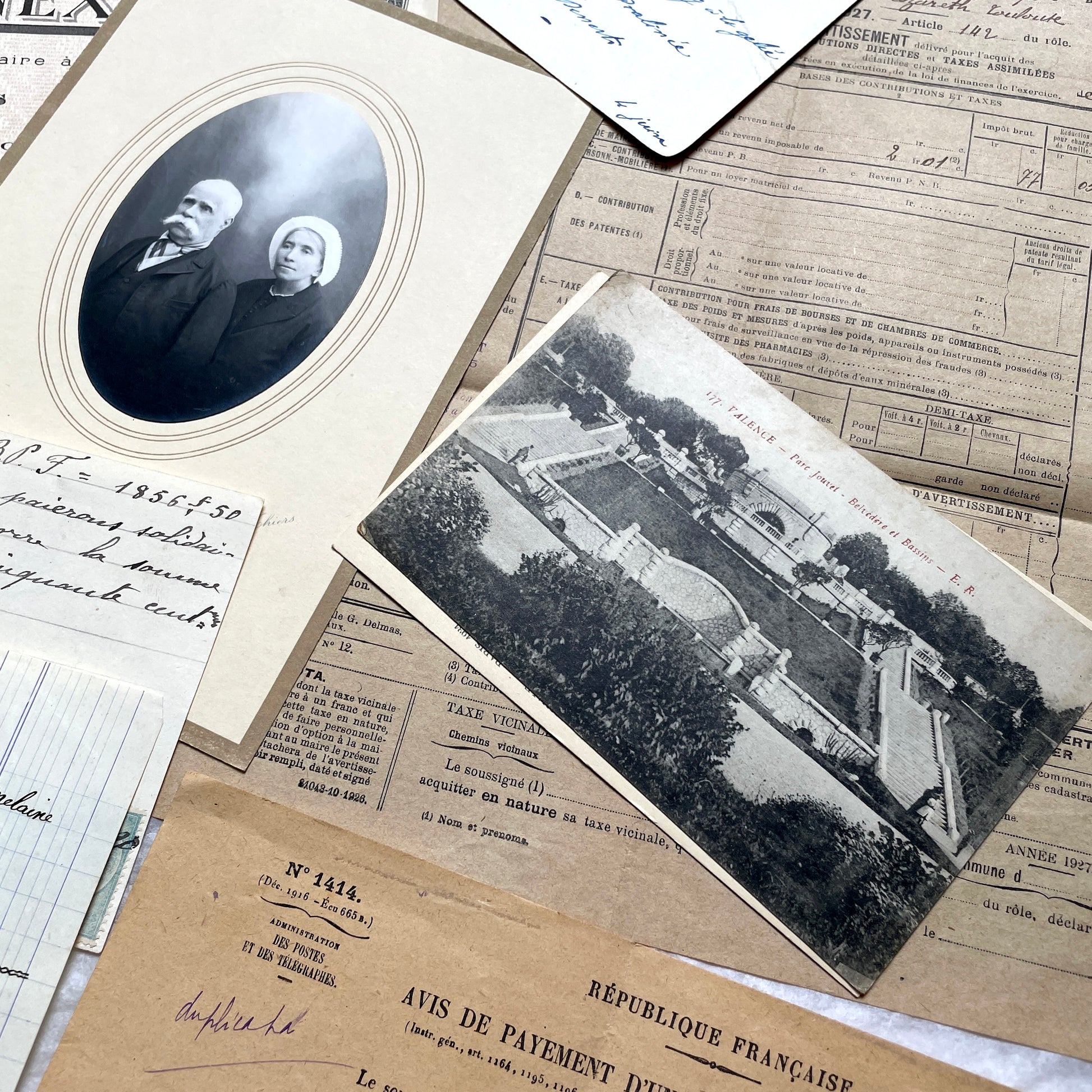 1920s French Documents Lot with a share certificate, handwritten letters, sheet music, and an old photograph.