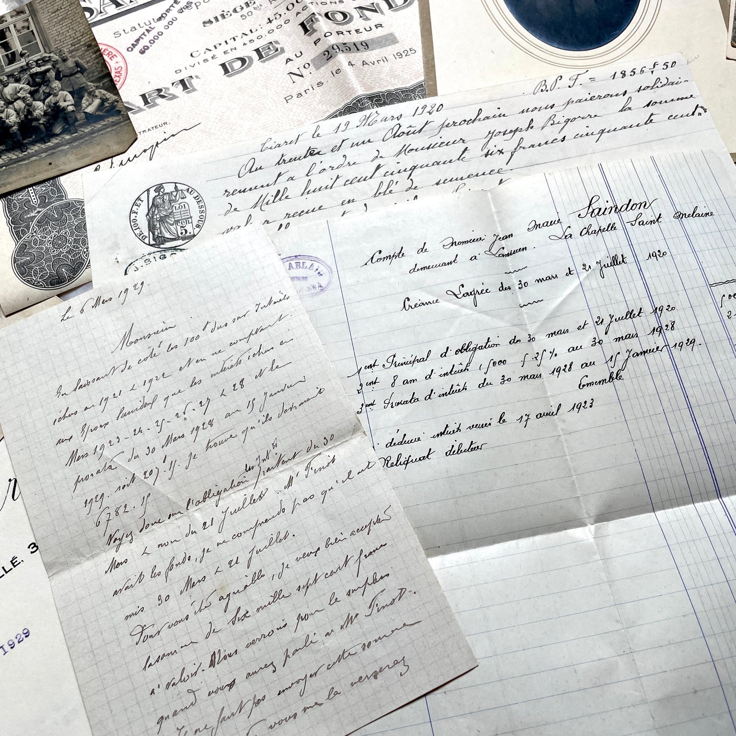 1920s French Documents Lot with a share certificate, handwritten letters, sheet music, and an old photograph.