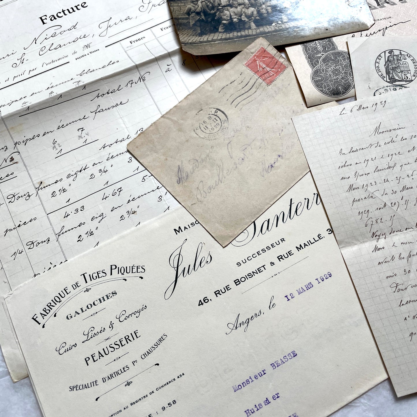 1920s French Documents Lot with a share certificate, handwritten letters, sheet music, and an old photograph.