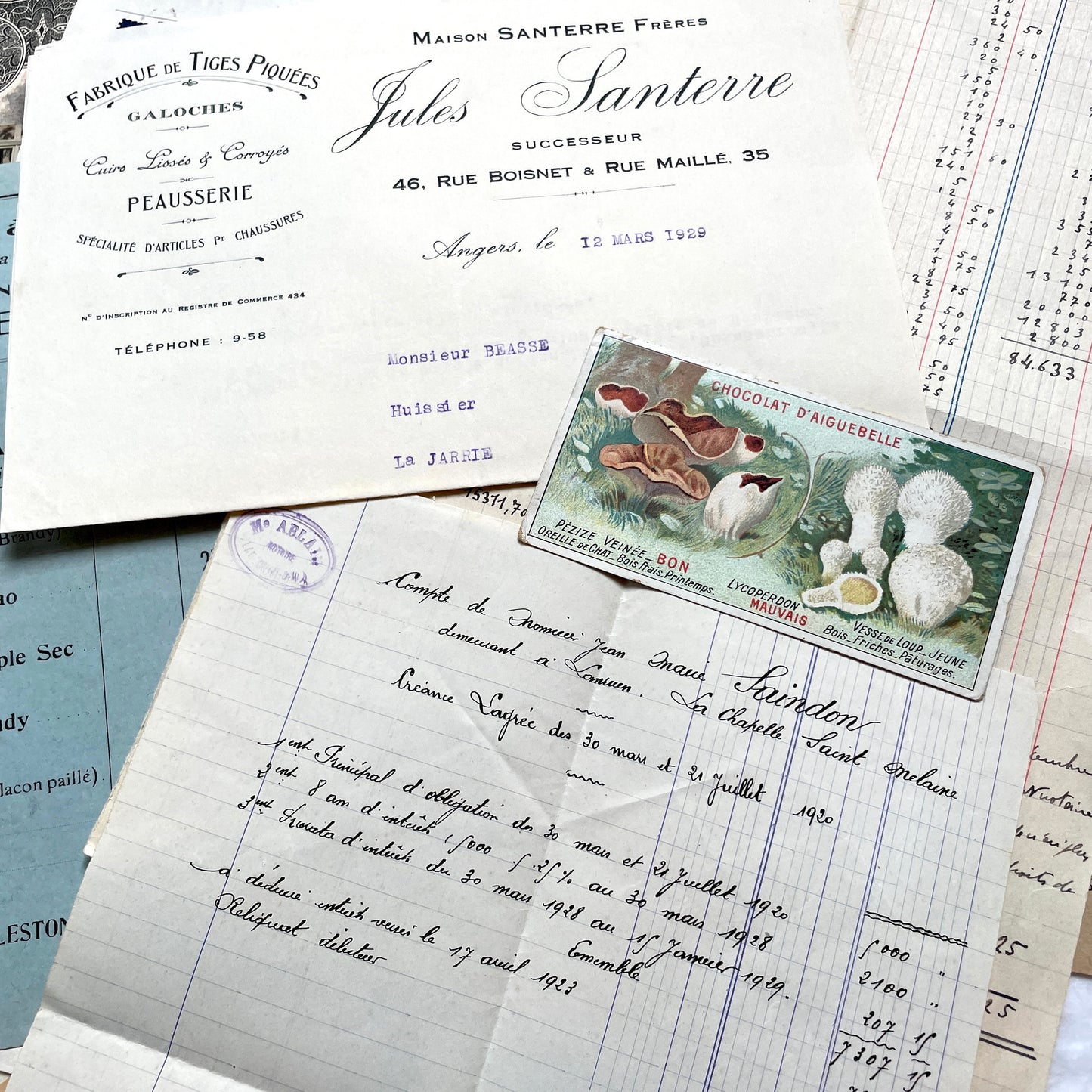 1920s French Documents Lot with a share certificate, handwritten letters, sheet music, and an old photograph.