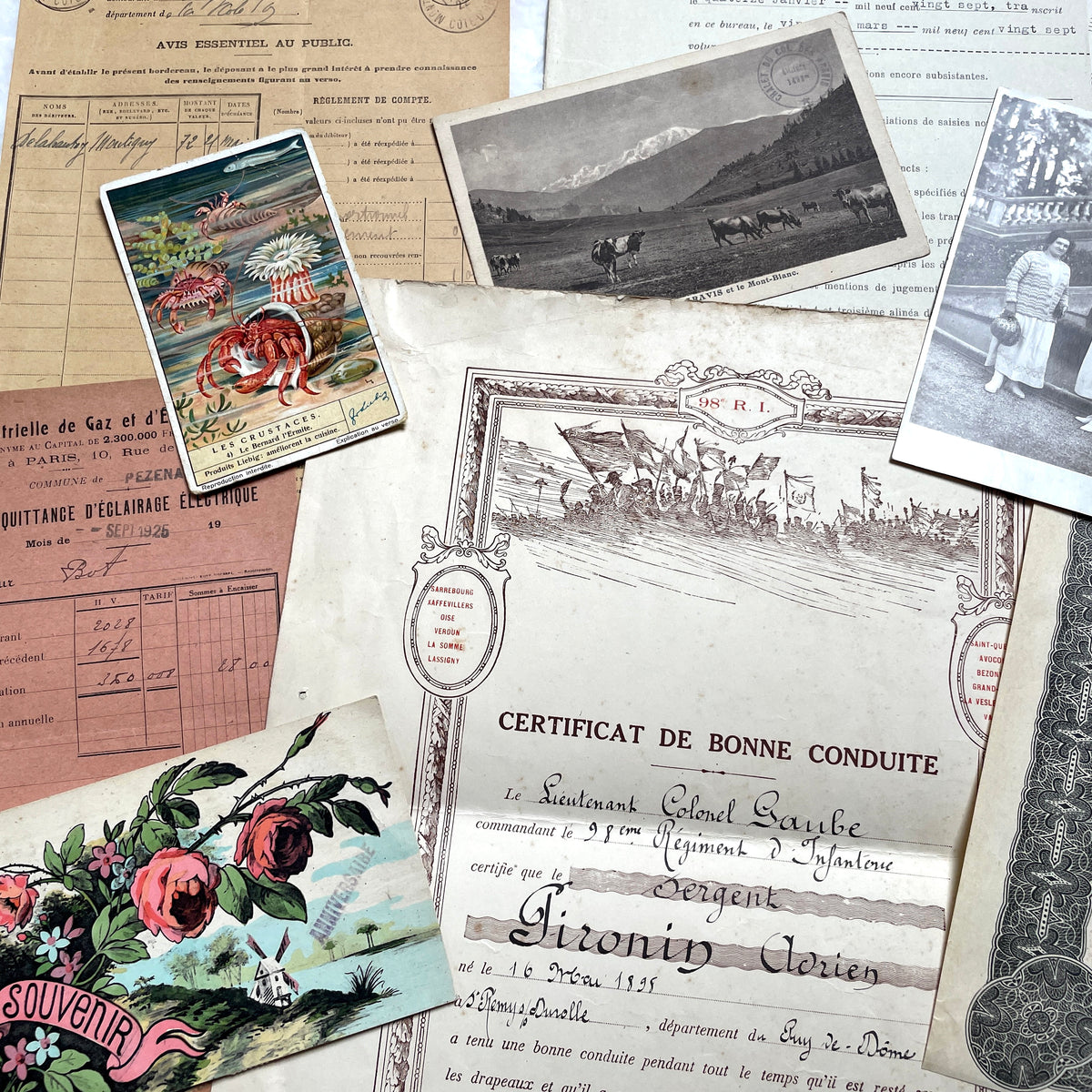 1920s French Ephemera Lot with various documents, vintage postcards, sheet music, period photos, and a stock certificate.