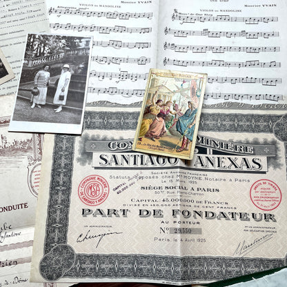 1920s French Ephemera Lot with various documents, vintage postcards, sheet music, period photos, and a stock certificate.