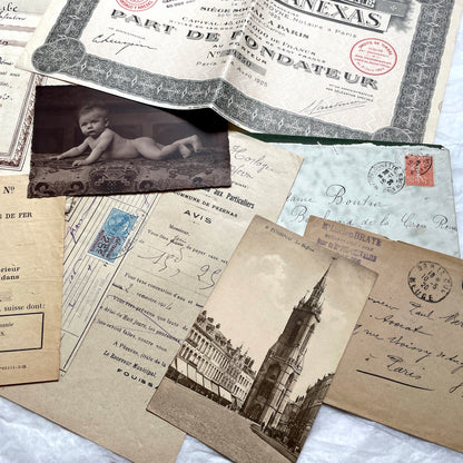 1920s French Ephemera Lot with various documents, vintage postcards, sheet music, period photos, and a stock certificate.