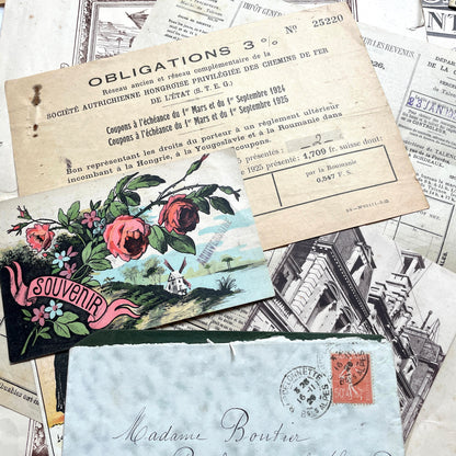 1920s French Ephemera Lot with various documents, vintage postcards, sheet music, period photos, and a stock certificate.