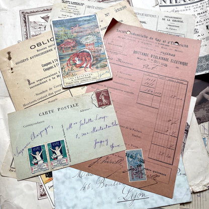 1920s French Ephemera Lot with various documents, vintage postcards, sheet music, period photos, and a stock certificate.